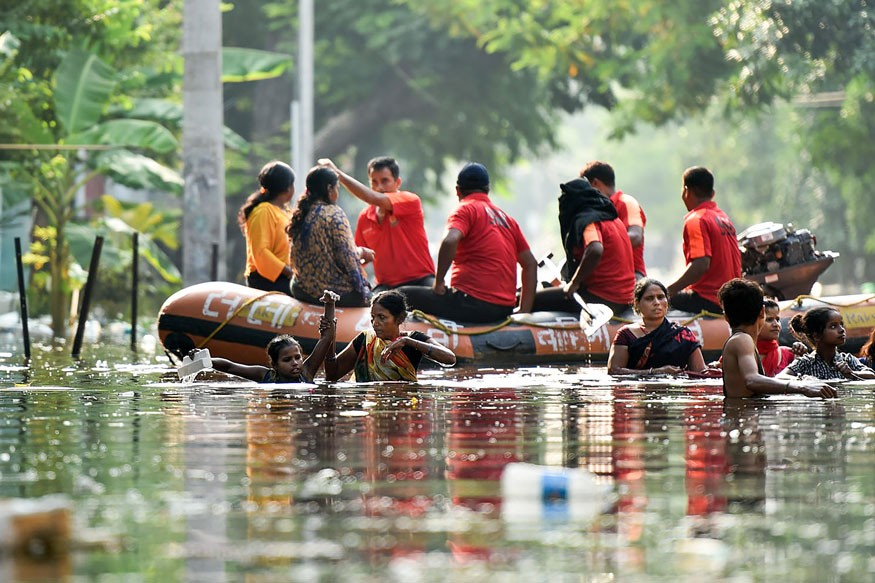 National and State Disaster Response Force workers rescue residents from flood-affected area of Rajendra Nagar following heavy monsoon rainfall, in Patna. (Image: PTI)